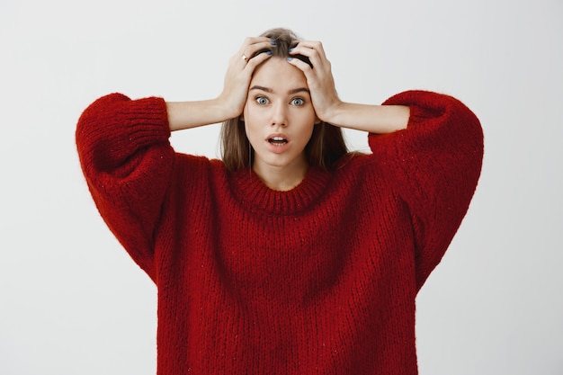 Worried Woman in Stylish Red Sweater – Free Stock Photo for Download