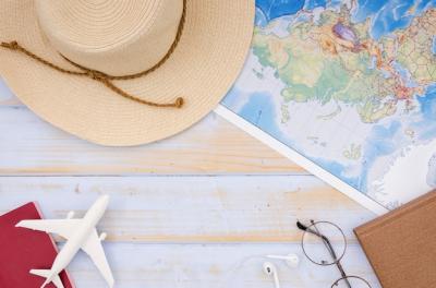 Map and Hat Flat Lay on Wooden Table – Free Stock Photo for Download