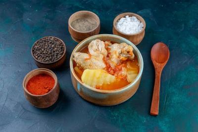 Chicken Soup with Potatoes and Seasonings on Dark-Blue Surface – Free Stock Photo for Download