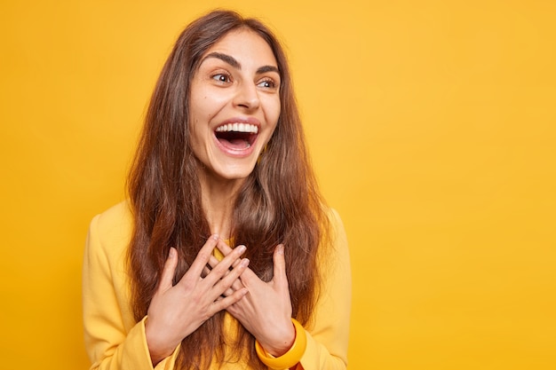 Joyful Candid Portrait of a Brunette Girl Smiling – Free Download