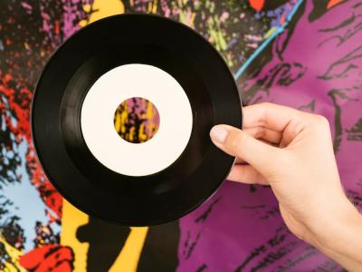 Retro Vinyl Disk Against Multicolored Wall – Free Download