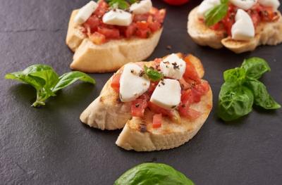 Bruschetta with Tomatoes, Mozzarella Cheese, and Basil on a Cutting Board – Free Stock Photo, Download Free