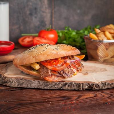 Delicious Side View of Doner with Tomato, Fried Potatoes, and Greens – Free Stock Photo, Download Free