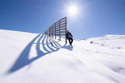 Male Standing on a Snowy Mountain Peak Under the Sunlight – Free Stock Photo Download