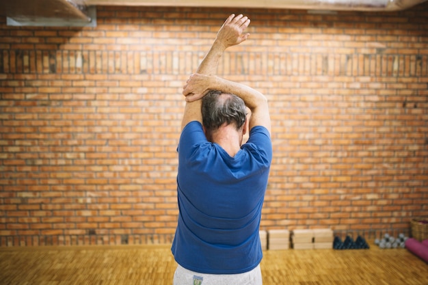 Man Stretching in Gym – Free Download