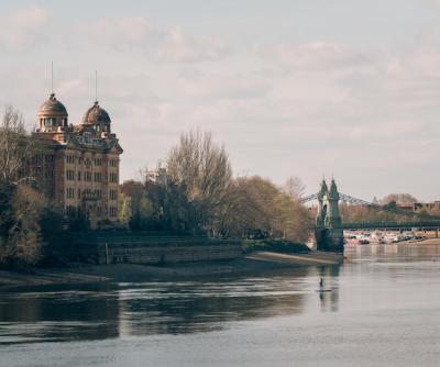 Magnificent Old Castle Captured by a Bridge Over a Beautiful River on a Cloudy Day – Free Download