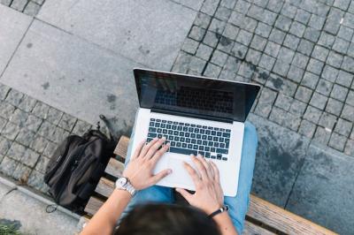 Man’s Hand Using Laptop from an Elevated View – Free Download