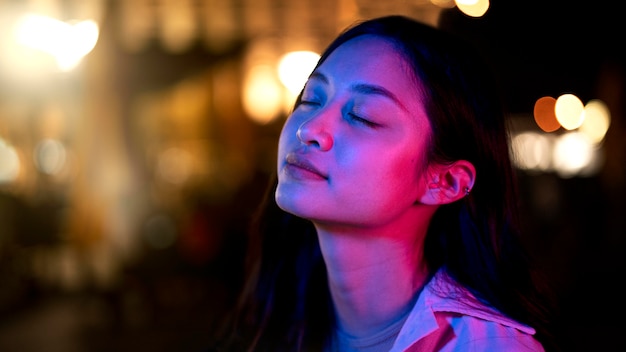 Beautiful Woman at Night Amidst City Lights – Free Stock Photo for Download