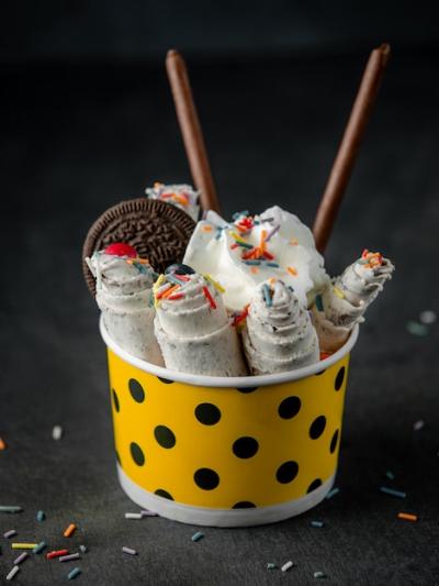 Thai Ice Cream Roll Topped with Colorful Sprinkles in Cardboard Bowl – Free Download