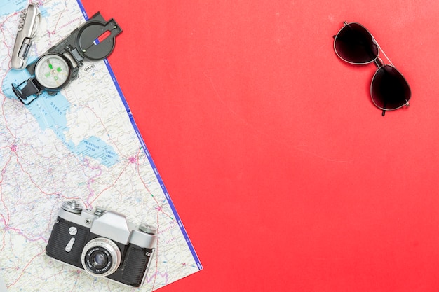 Sunglasses near Compass and Camera on Map – Free Stock Photo for Download