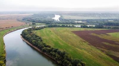 Aerial Drone View of Moldova’s Nature: Floating River and Green Fields – Free Download