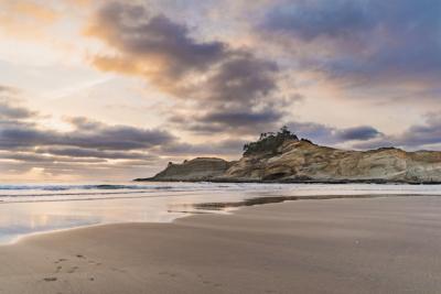 Cliff by the Sea with Sandy Shore and Cloudy Sky – Free Stock Photo for Download