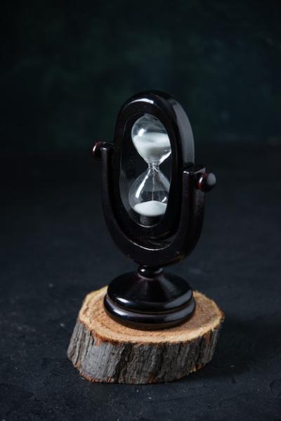 Black Hourglass On Dark Surface – Free Download