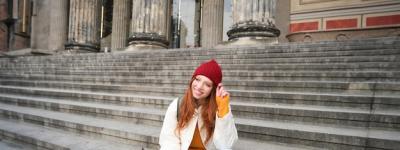 Young Redhead Woman Engaged in Social Media on Mobile Phone – Free Download