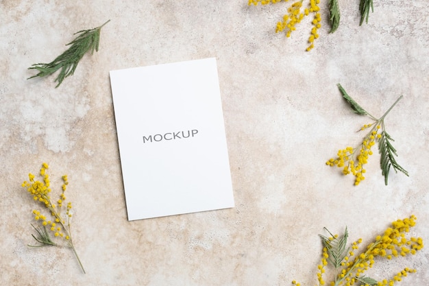 Blank Invitation Card Mockup Featuring Yellow Mimosa Flowers on Beige Background – Free Download