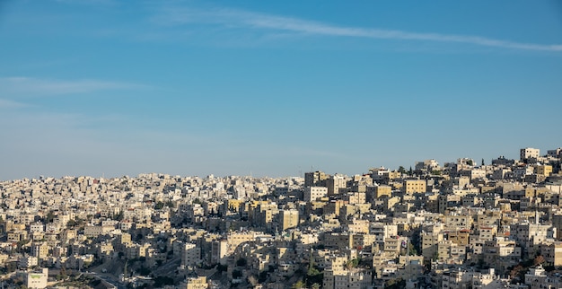 Wide Angle Cityscape Under Clear Blue Sky – Free Download