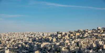 Wide Angle Cityscape Under Clear Blue Sky – Free Download