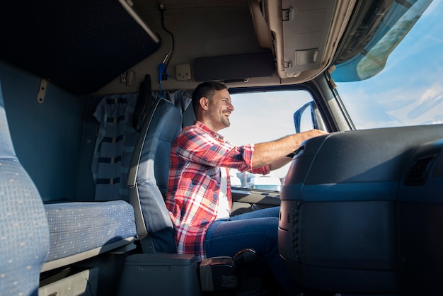 Happy Middle-Aged Truck Driver on Highway – Free Stock Photo for Download