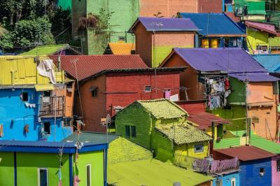 Colorful Small Houses with Clothes Hanging Outside in a Suburban District – Free to Download