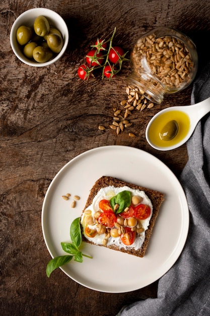 Delicious Toast Slice Topped with Cherry Tomatoes and Seeds – Free Download