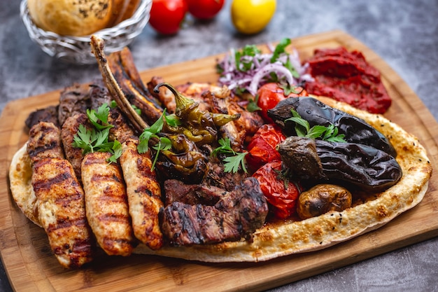 Kebab Platter Featuring Lamb and Chicken Lula, Tikka Kebabs, Grilled Vegetables, and Red Onion Salad – Free Download