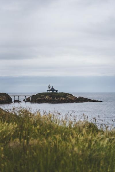 Isla Pancha Island Surrounded by the Sea Under a Cloudy Sky in Spain – Free Download