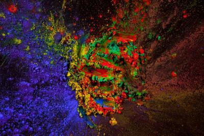 Vibrant Mixture of Holi Color Powder on Dark Background – Free Download