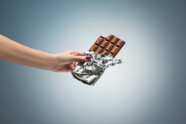 Chocolate Tile in Woman’s Hand – Free Download