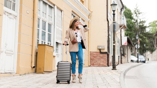 Full Shot of a Woman Carrying Baggage – Free Download