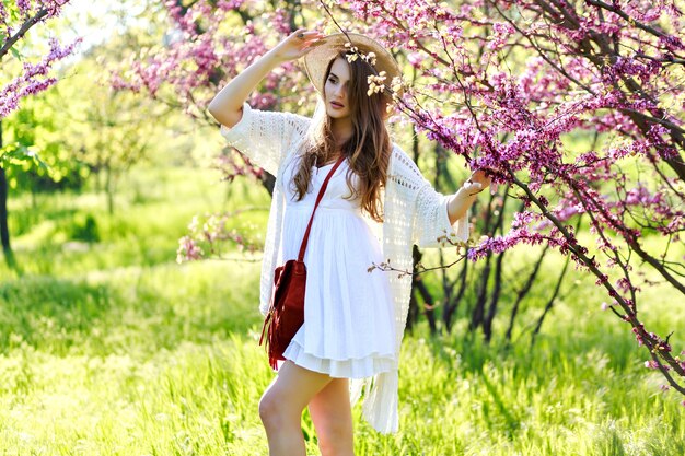 Charming Young Woman in Summer Hat and White Dress Amidst Blooming Sakura – Free Download