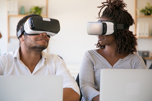 Excited African American Testers Wearing VR Glasses in Office – Free Download