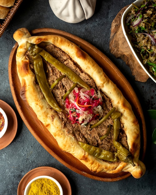 Traditional Georgian Cuisine Khachapuri with Meat and Pickled Chili Peppers – Free Download