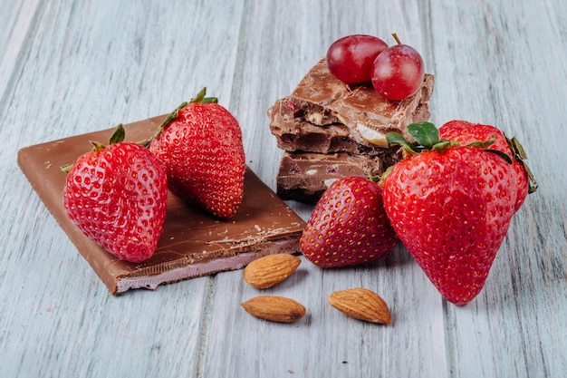 Strawberries Topped with Chocolate and Almonds on a Gray Surface – Free Download