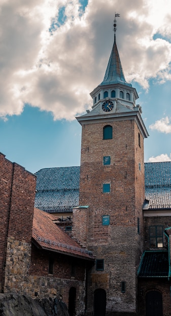 Historic Akershus Fortress in Oslo, Norway Against a Stunning Cloudy Sky – Free Stock Photo for Download