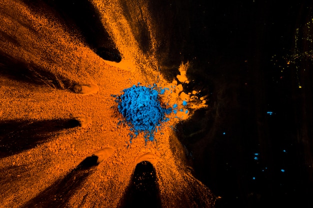 Blue and Orange Powder on Black Surface – Free Stock Photo for Download