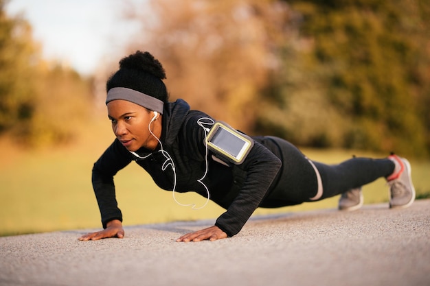 African American Female Athlete Practicing Pushups in the Park – Free Download