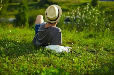 Young Stylish Man in Hat and Glasses Relaxing on Grass | Free Stock Photo for Download