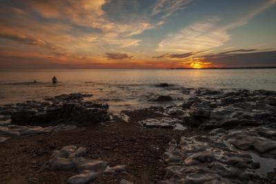 Swimmers at Sunset in South Wales – Free Stock Photo for Download