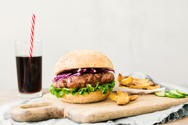 High Angle Close-Up of Burger and Fries on Wooden Board – Free to Download