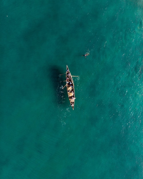 People Fishing in a Boat at Varkala Beach – Free Stock Photo for Download