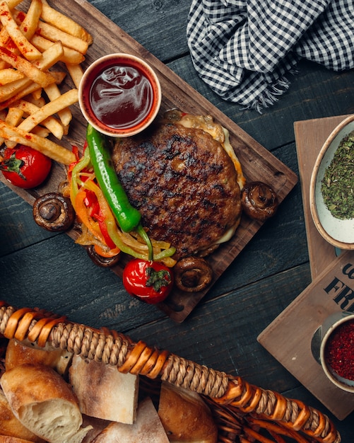 Grilled Lamb Bunless Burger with Roasted Bell Peppers and Fries – Free Download