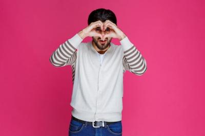 Man in White Shirt Sending Love – Free Stock Photo for Download