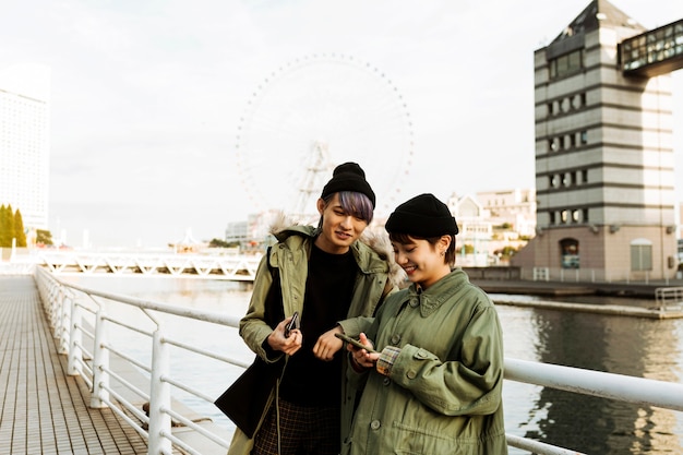 Couple Holding Phones – Free Download Stock Photo