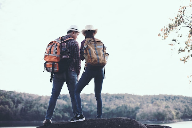 Couple Traveling with Mountain Background – Free Download