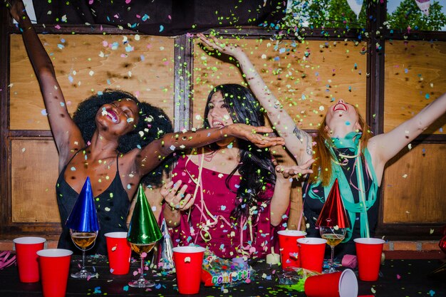 Laughing Friend Surrounded by Confetti – Download Free Stock Photo