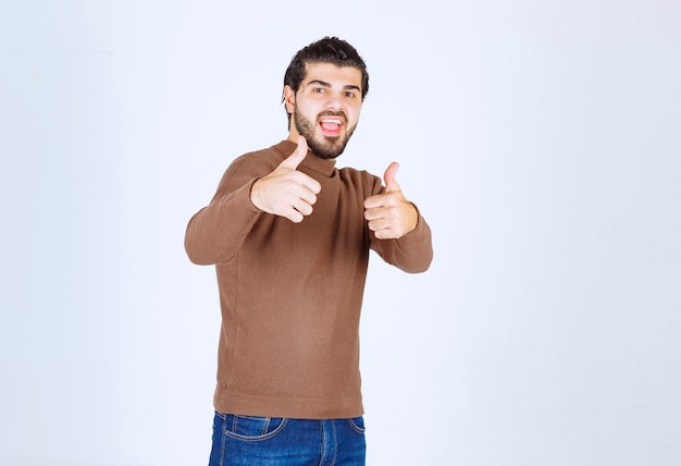 Handsome Young Man Giving Thumbs Up – Free Stock Photo for Download