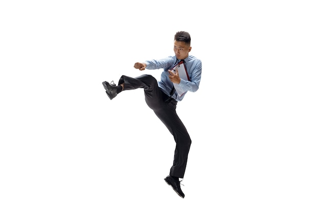 Office Man Practicing Taekwondo on White Wall – Free Download