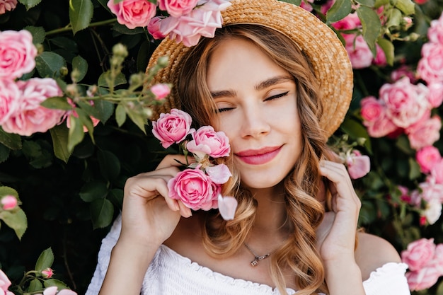 Ecstatic Curly Girl with Roses – Summer Portrait