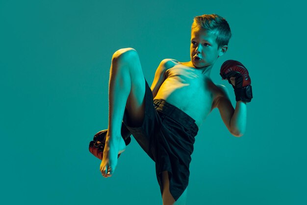 Little Boy Training in Thai Boxing Gloves: Free Stock Photo Download