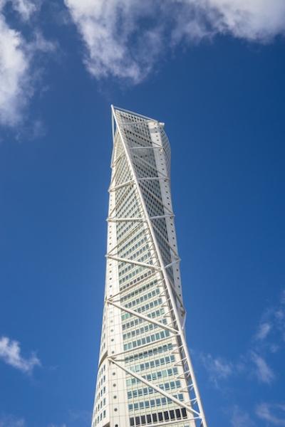 Turning Torso in MalmÃ¶, Sweden: Low Angle View Under Blue Sky – Free Download